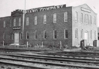 The Petit building of 1898 right on the railroad tracks.