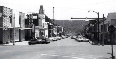 Rising Sun facing east on Main Street in 1980 with the forested Ohio River shore of Rabbit Hash, KY