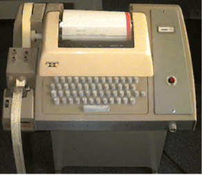 Teletype Corporation Model 33 ASR with paper tape reader/punch on the left.