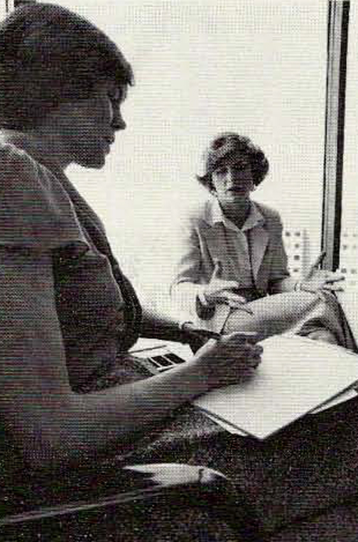 Linda La Barre, Manager of Marketing for Comshare's Personnel Services Division, Profiles discusses a proiect with Carol Barnford, left side of photo who is a writer in the Publications Department.